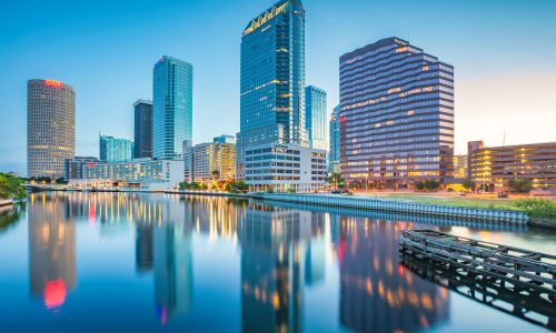 Skyline of downtown Tampa Florida USA and the Hillsborough River at twilight blue hour.